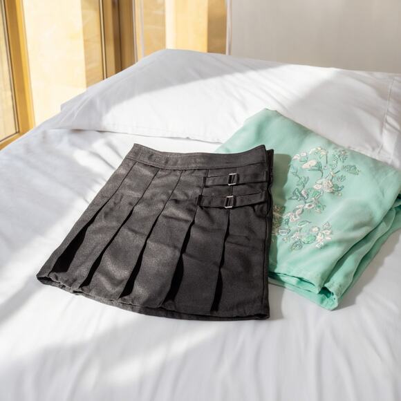 Women's Black Pleated Mini Skirt with Buckle Hardware - Picture 3 of 6